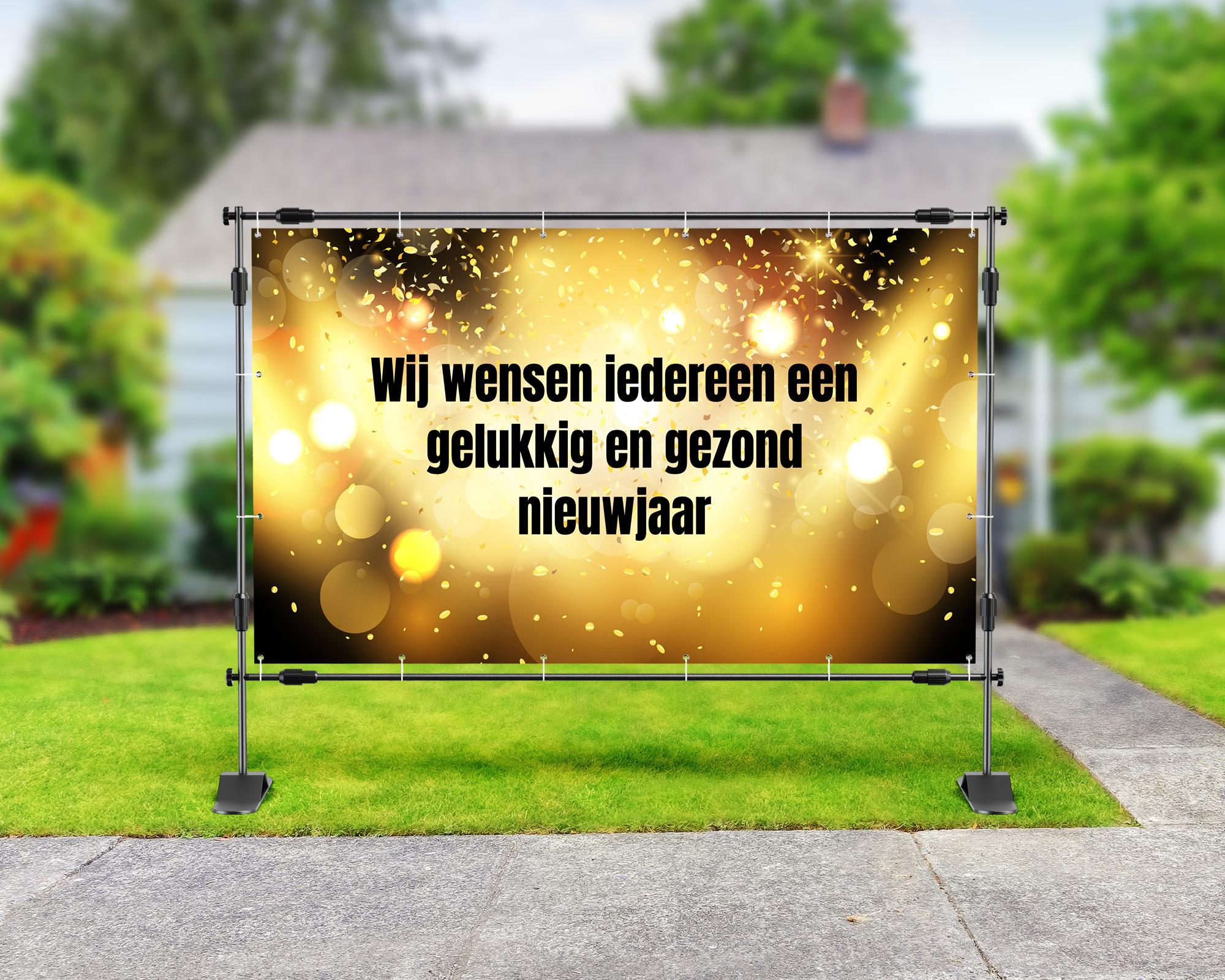 Spandoek oud & nieuw met gouden bokeh en confetti, en de boodschap: “Wij wensen iedereen een gelukkig en gezond nieuwjaar”.